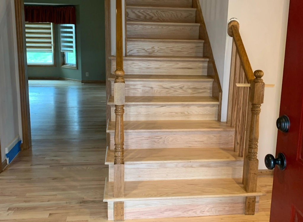 newly refinished staircase with hardwood floors